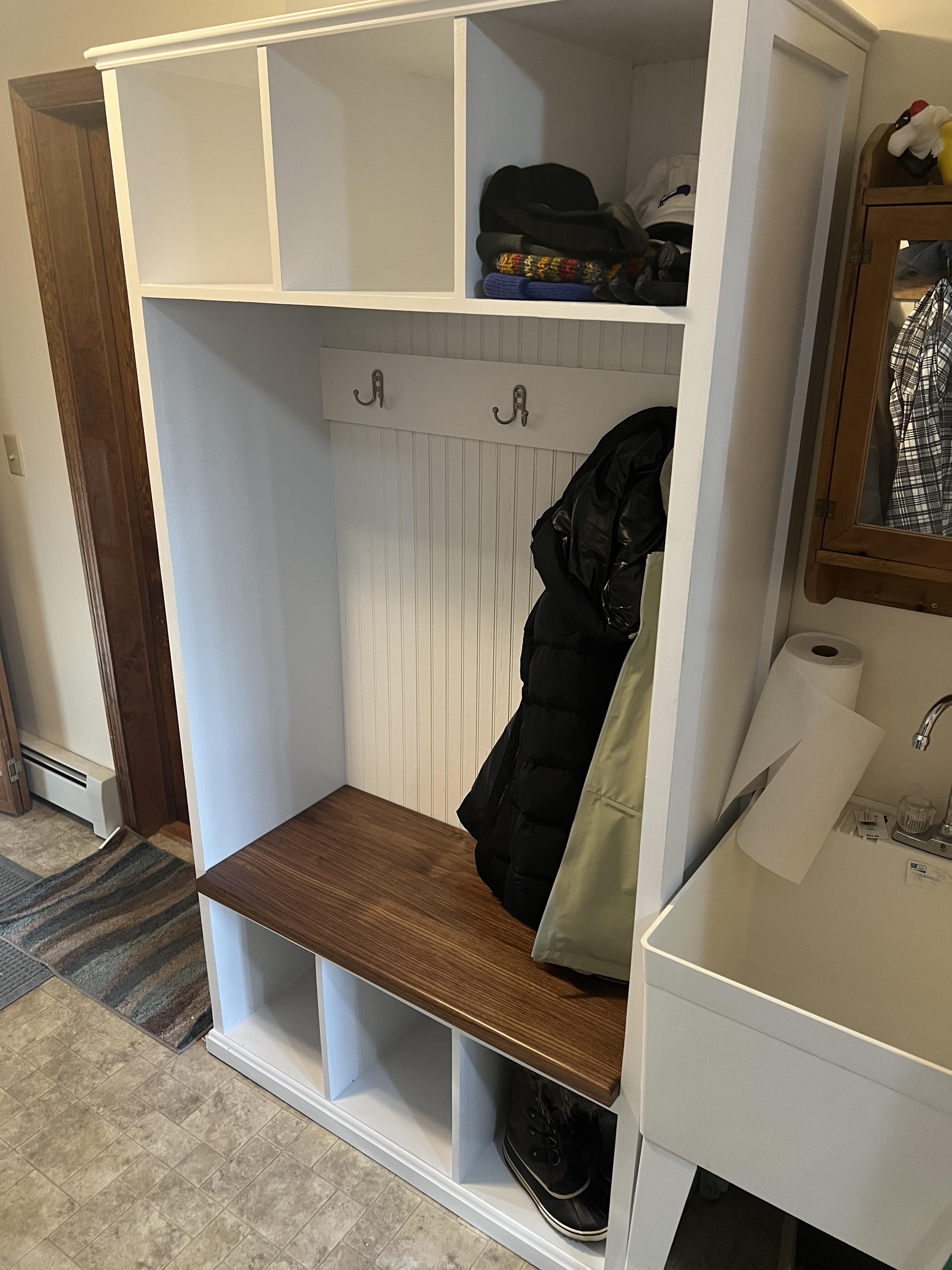 Gilmanton Hall Tree: A white cabinet with a bench and coat rack.