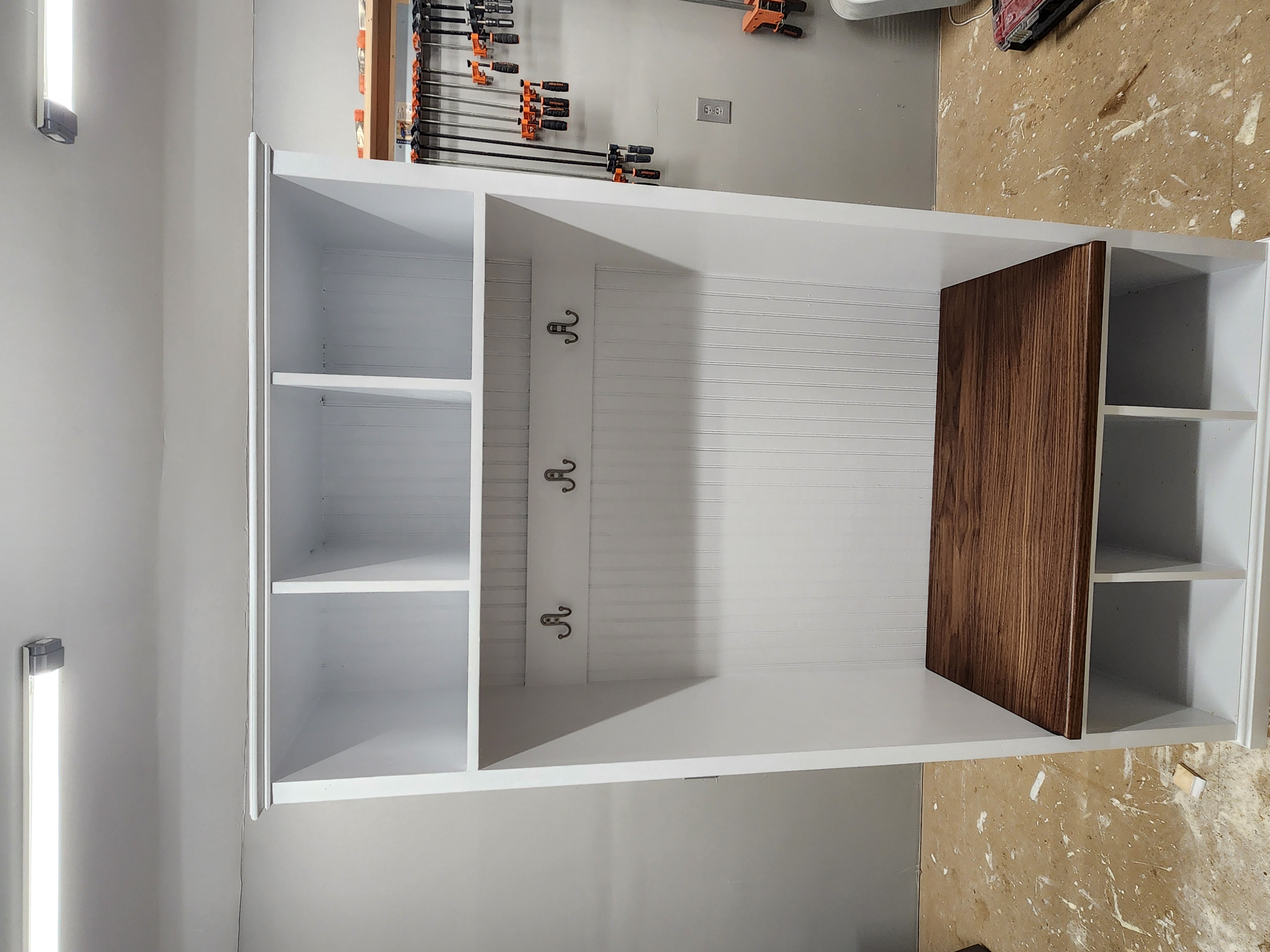 Gilmanton Hall Tree: A white cabinet with a bench and coat rack.