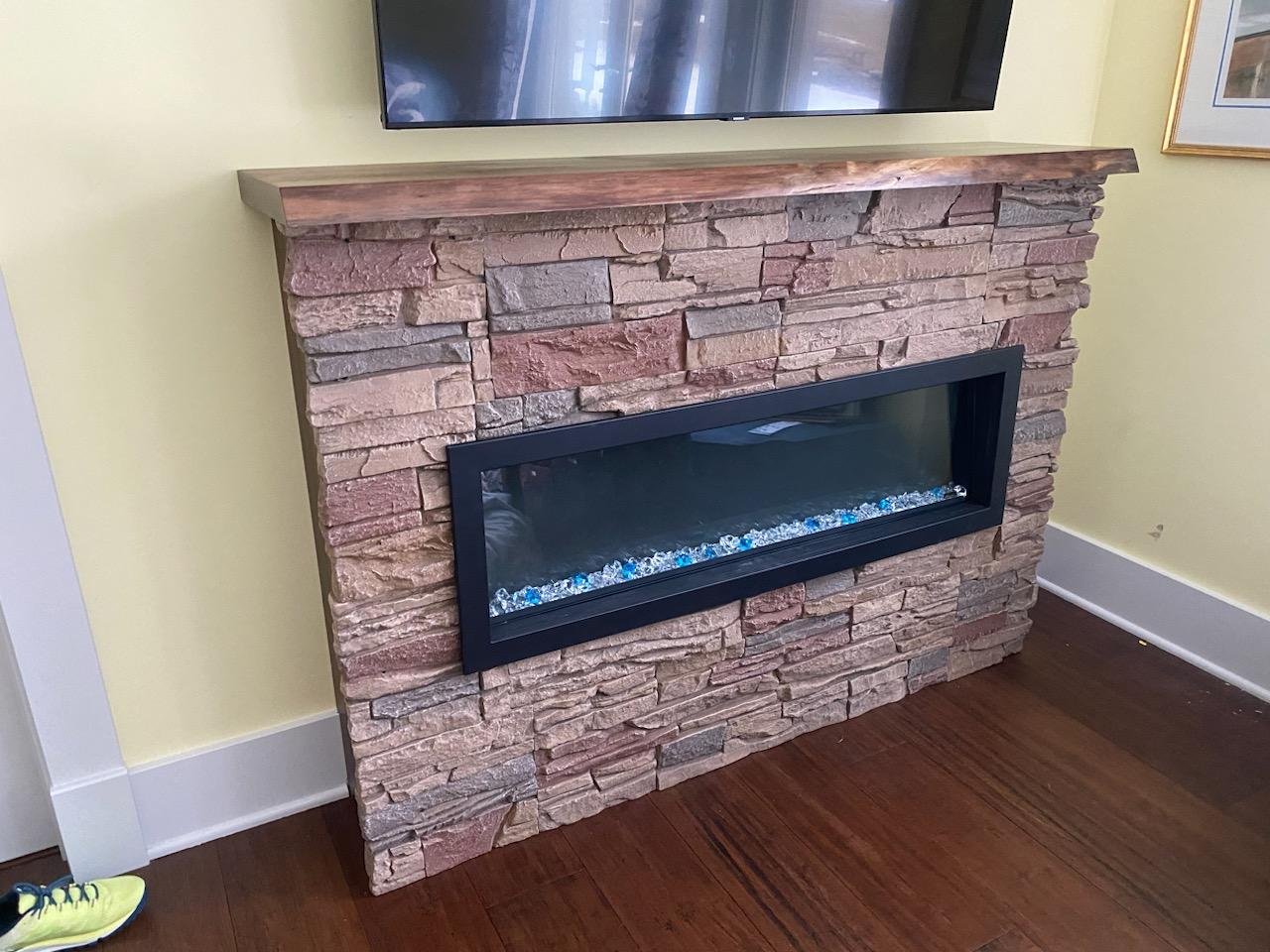 Custom made mantel 65 1/2 long
13 1/2 deep
1 1/2 thick
Black Walnut  live edge 
Satin Polyurethane 